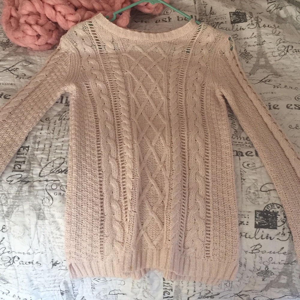 a light pink, casual sweater
